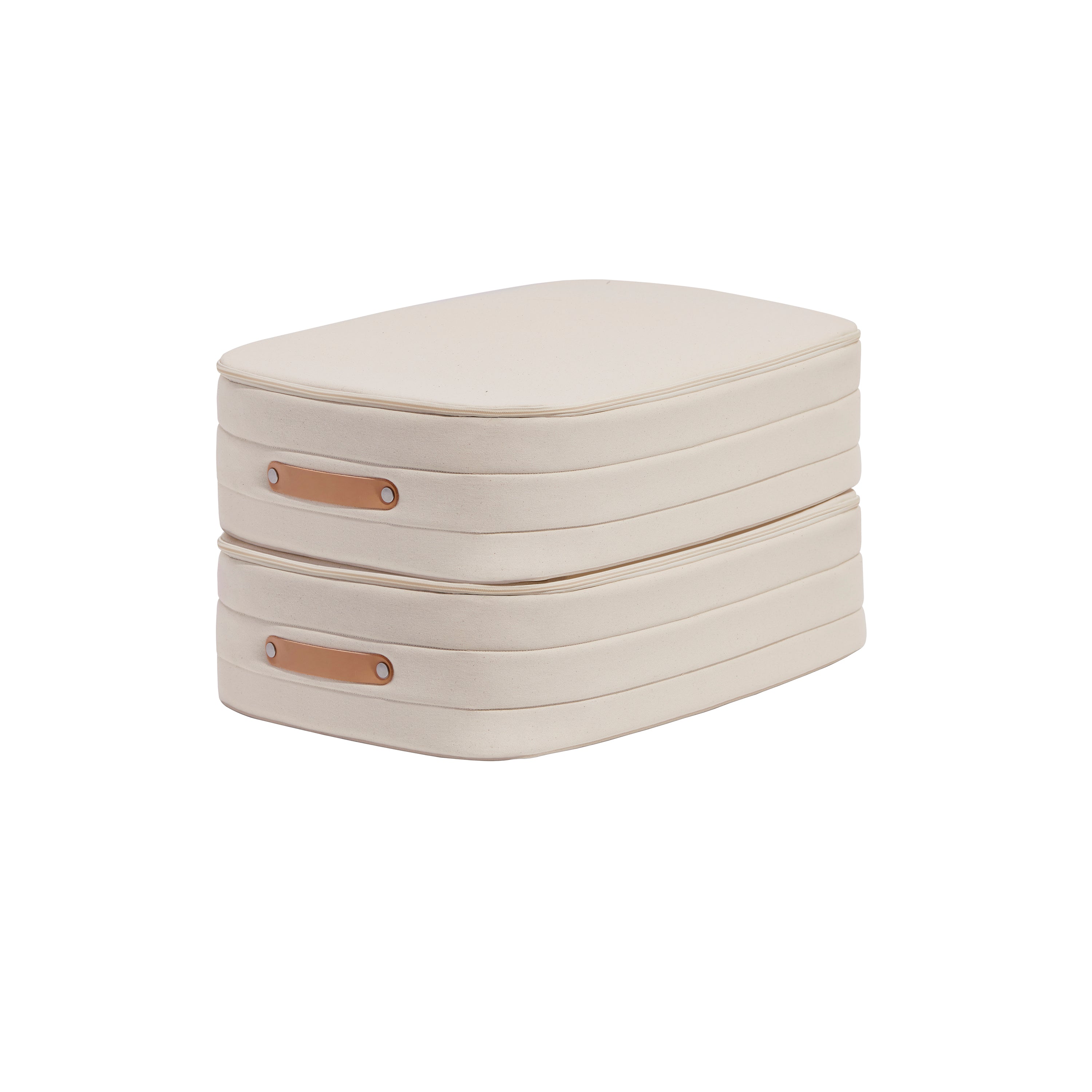 The Open Spaces Underbed Storage includes two stackable, natural canvas storage boxes in beige with side brown leather handles, providing breathable protection for your belongings.